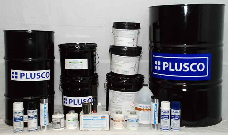 Assortment of PLUSCO lubricant drums, pails, cartridges and containers
