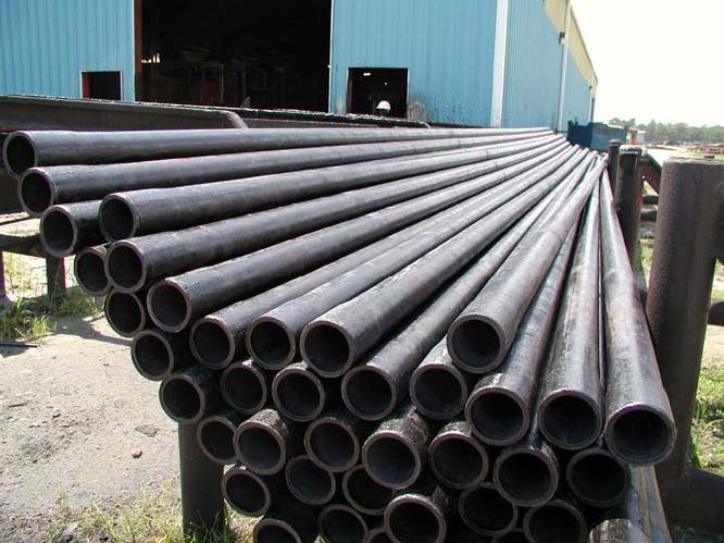 Stacked black coated pipes for PLUSCO 376 Black